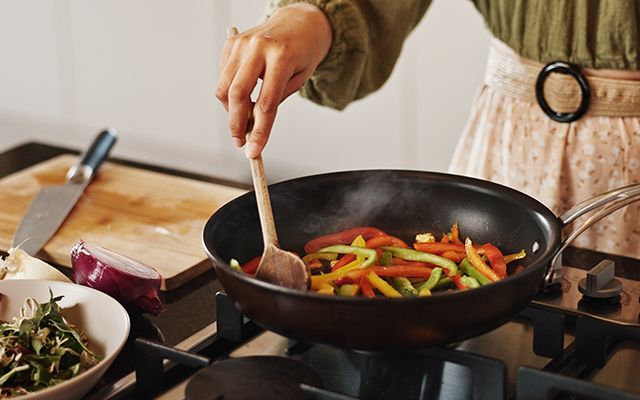 Chef sauteing vegetables