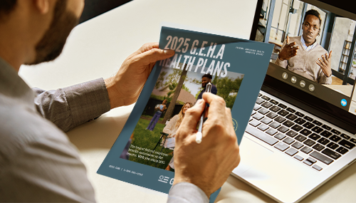 Man on facetime with adviser while holding brochure